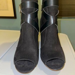 Peep toe black booties.